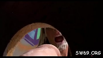 Sexy mother i'_d like to fuck gets down at gloryhole and sucks a big fake dick